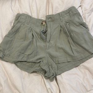 Light green shorts.